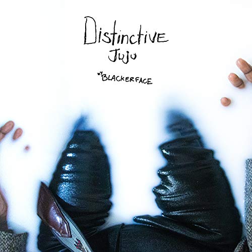 Album cover with black and white imagery of shoes and hands.