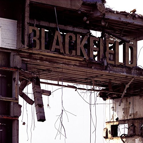 The word BLACKFIELD in large letters atop a ruined, concrete building structure.