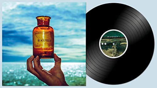 Blackfield V vinyl record with amber bottle and hand imagery.