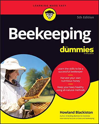 Cover of Beekeeping For Dummies book showing a beekeeper holding a frame of bees.