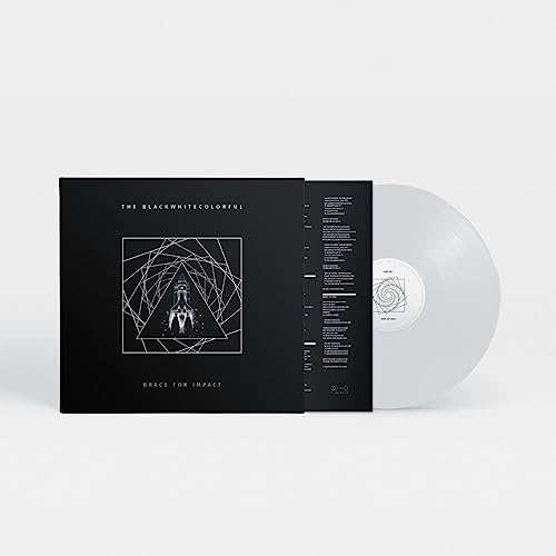 Black and white vinyl record with geometric cover art and white disc.