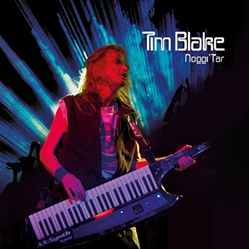 "Musician playing keytar on stage with blue and red lighting effects."