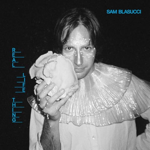 Album cover: Sam Blasucci portrait with flower, black and white aesthetic.
