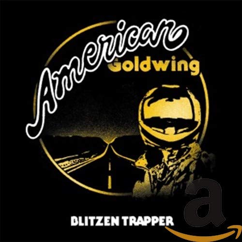 Album cover featuring a motorcyclist in a helmet on a road inside a circle.