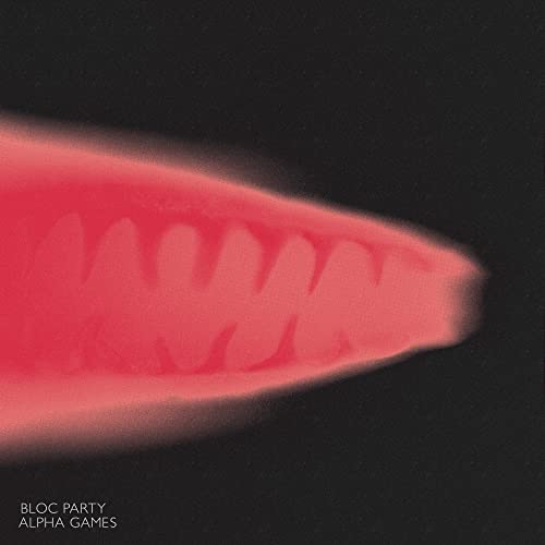A blurry red shape resembling teeth on a black background with text below.