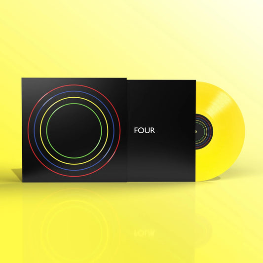 Bloc Party “Four” vinyl record with yellow disc and colorful cover.