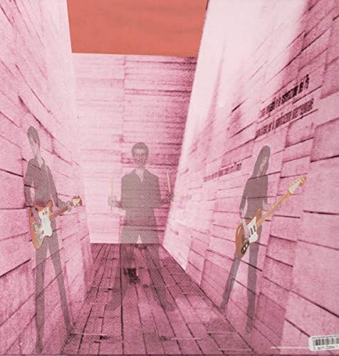 Three silhouetted figures playing instruments in a pink-toned, textured corridor with a red ceiling.