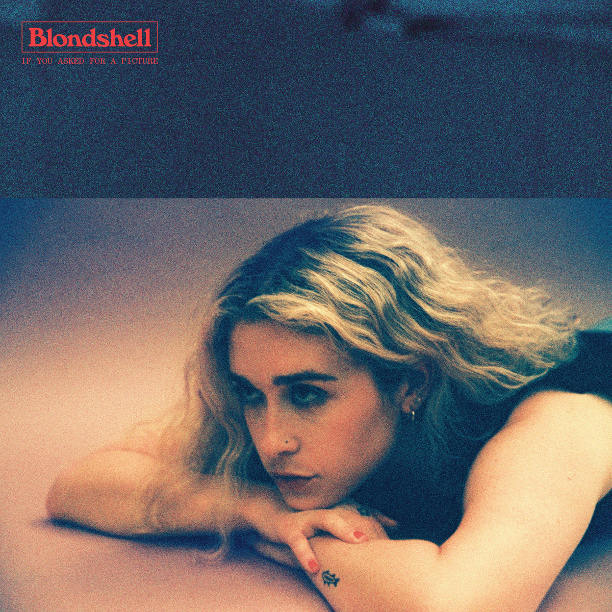 Blondshell album cover featuring a young woman with blonde hair.