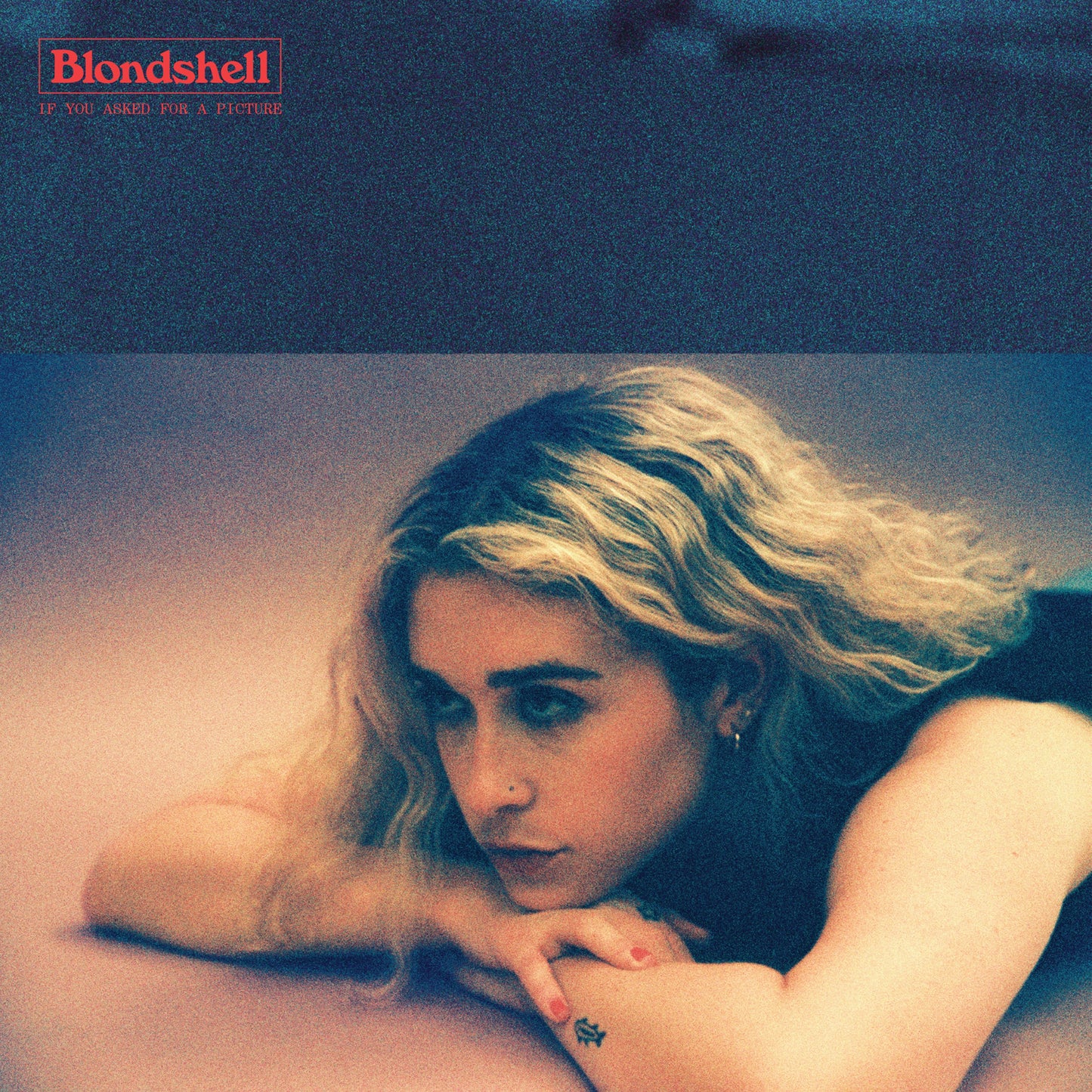 Album cover with a portrait of a blonde woman looking downward.