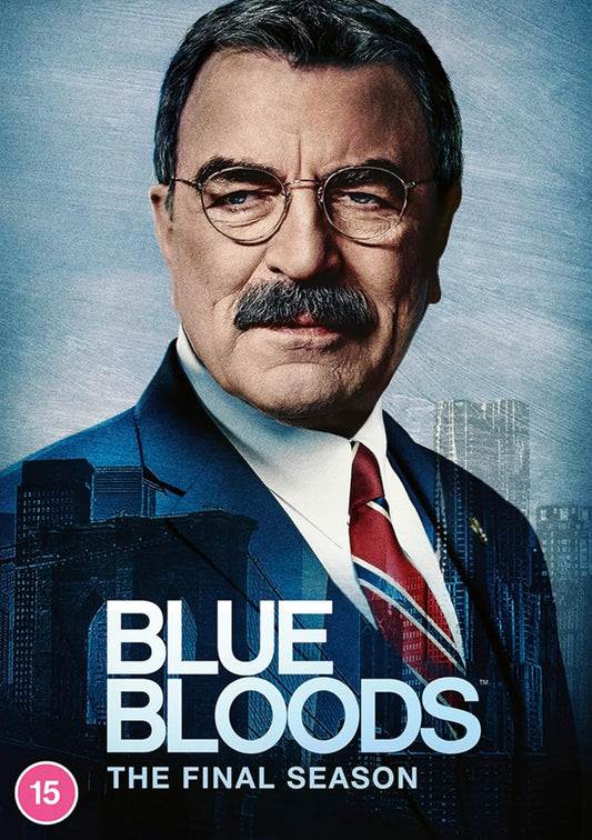 Tom Selleck in a suit and tie against a blue New York City skyline background.