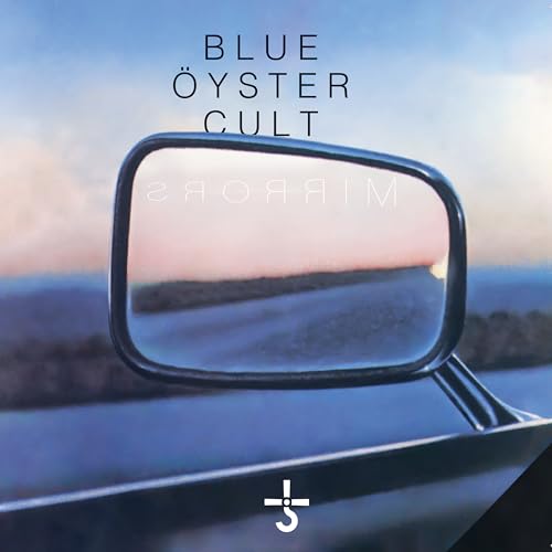 Car side mirror reflecting a landscape with Blue Oyster Cult text above.