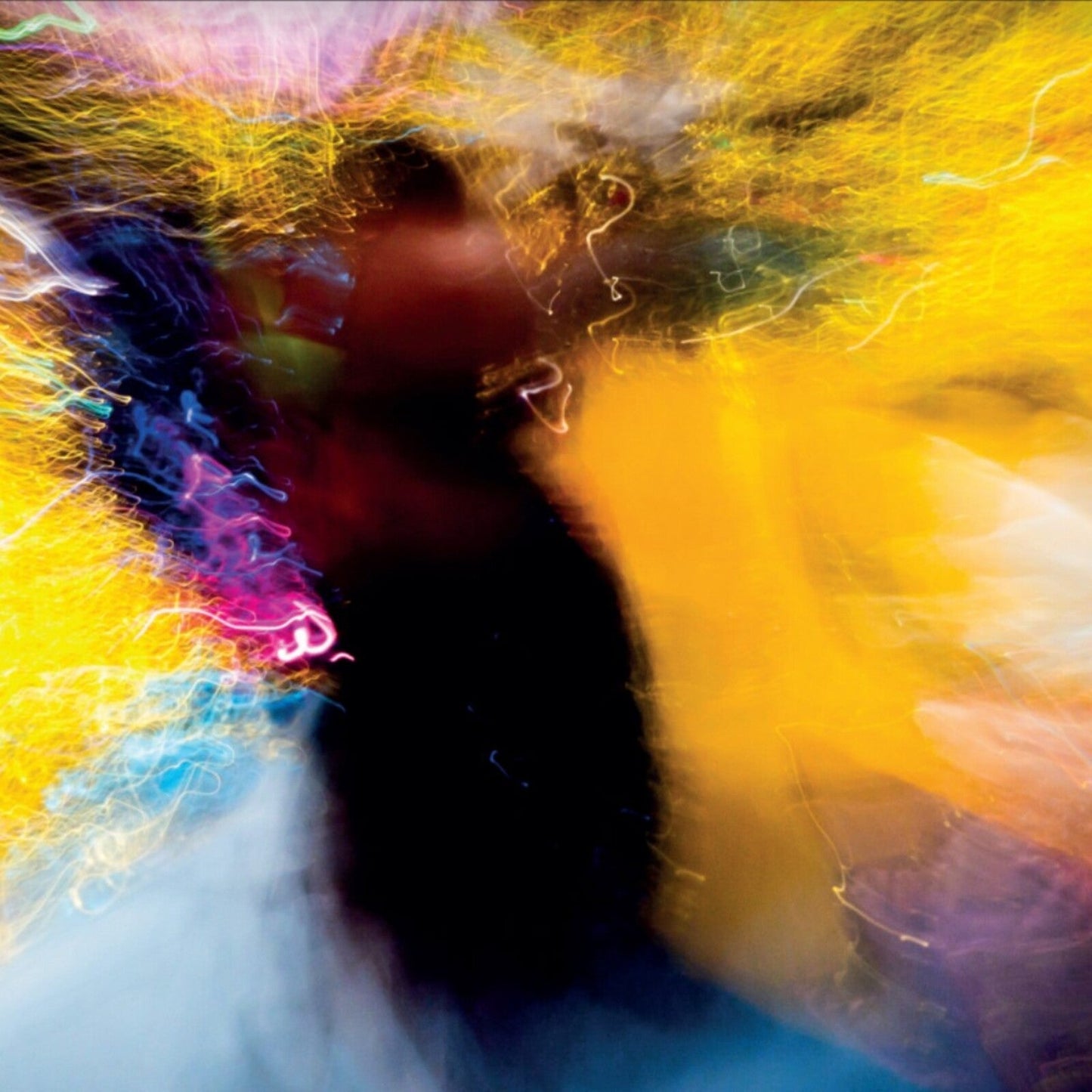 Abstract album cover with blurred face and colorful light streaks.