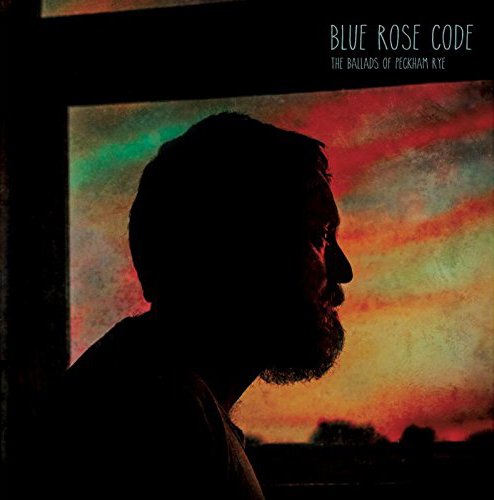 CD cover: Silhouette of a man against a colorful, blurred sunset.