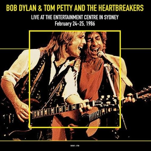 Bob Dylan and Tom Petty performing live with guitars, 1986 concert album.