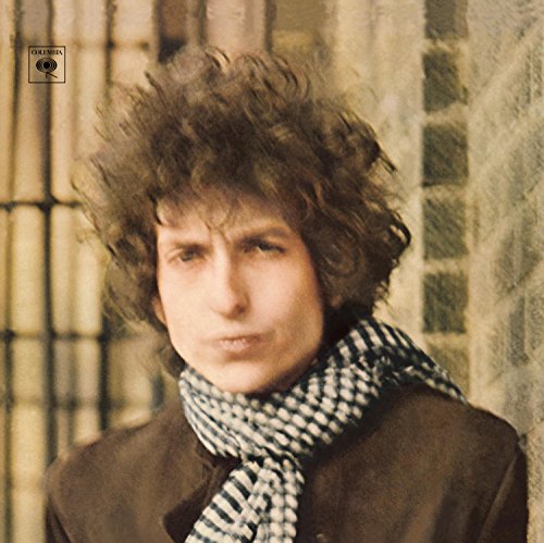 Bob Dylan album cover: portrait of a young man with curly hair.