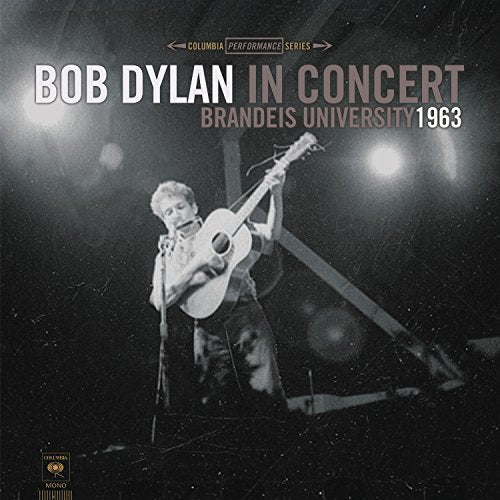 Black and white album cover of Bob Dylan playing guitar onstage.