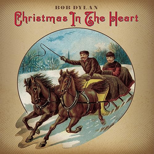 Bob Dylan’s “Christmas In The Heart” album cover with a winter scene.