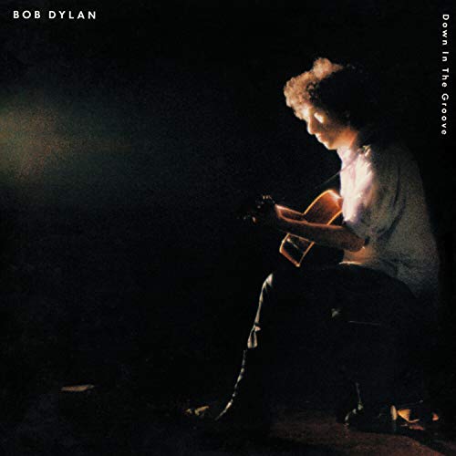 Bob Dylan album cover: a shadowed portrait of him playing guitar.