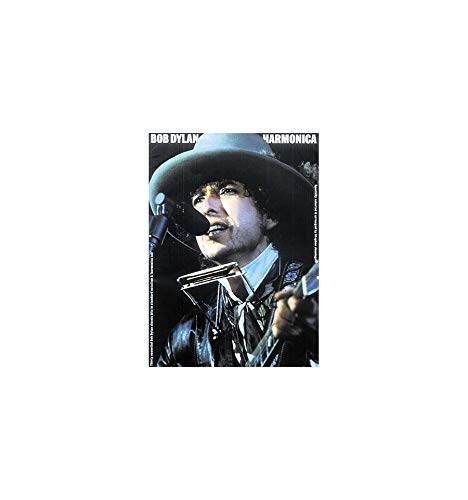 Bob Dylan in a hat playing a harmonica into a microphone.