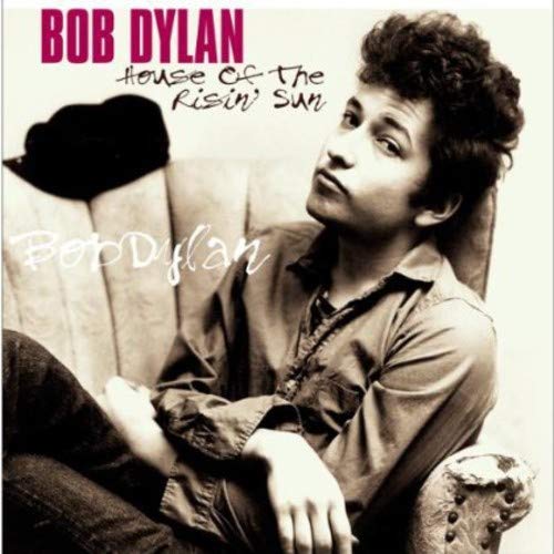 Black and white Bob Dylan album cover with man sitting on ornate armchair.