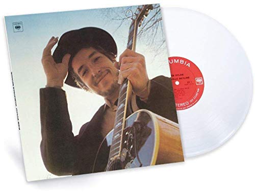 Bob Dylan album cover and white vinyl record shown at angle.