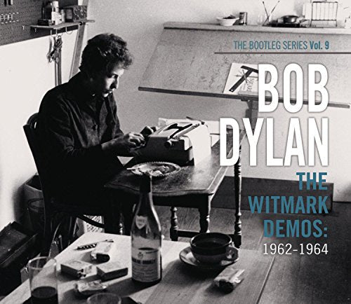 Black and white album cover of Bob Dylan sitting at a desk.
