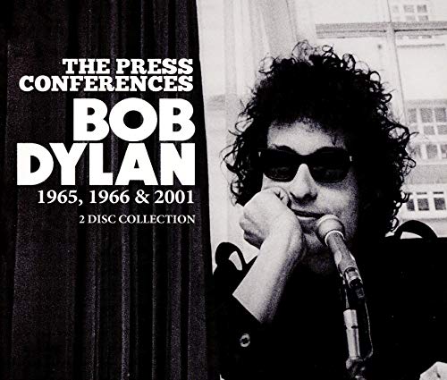 Black and white album cover featuring Bob Dylan with a microphone.