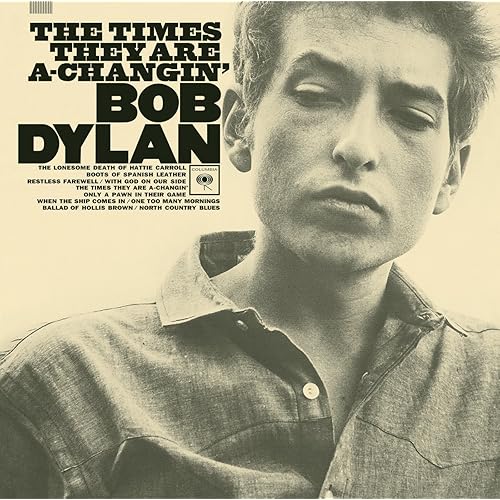 Bob Dylan album cover, sepia-toned portrait, "The Times They Are A-Changin'.