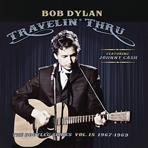Bob Dylan album cover, featuring a black and white photo of him with a guitar.