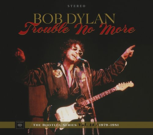 Bob Dylan album cover featuring the artist singing into a microphone with guitar.