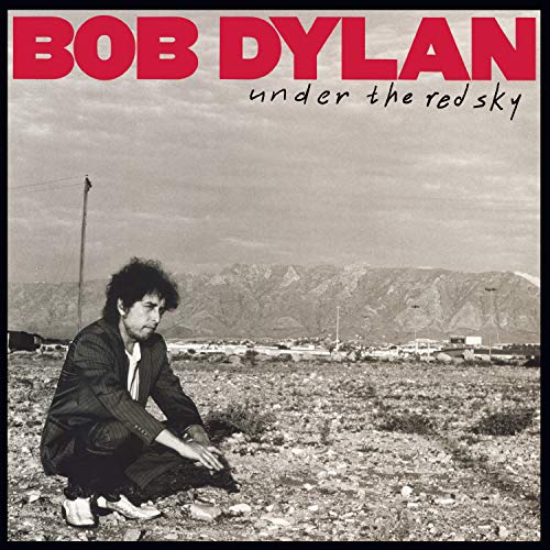 Bob Dylan album cover, "Under The Red Sky," with a desert landscape.