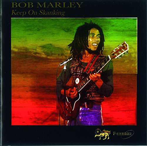Bob Marley playing guitar, album cover with green, gold, and red tones.