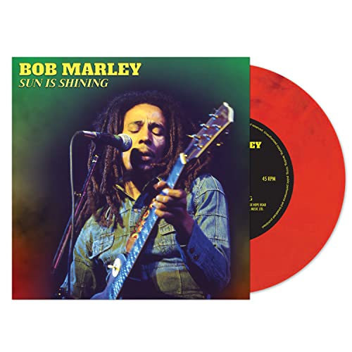 Bob Marley vinyl record cover and orange record disc shown.
