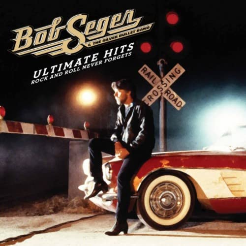 Bob Seger album cover featuring a man by a classic red car.