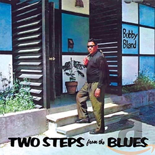 Bobby Bland album cover: man on steps, blue and white background.