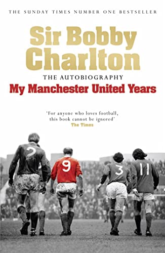 Book cover: Sir Bobby Charlton’s autobiography with footballers in red shirts.