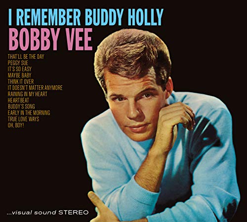 Bobby Vee wearing a light blue sweater on an album cover with song titles.