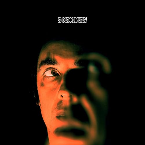 CD cover with distorted close-up of a man’s face and eye.