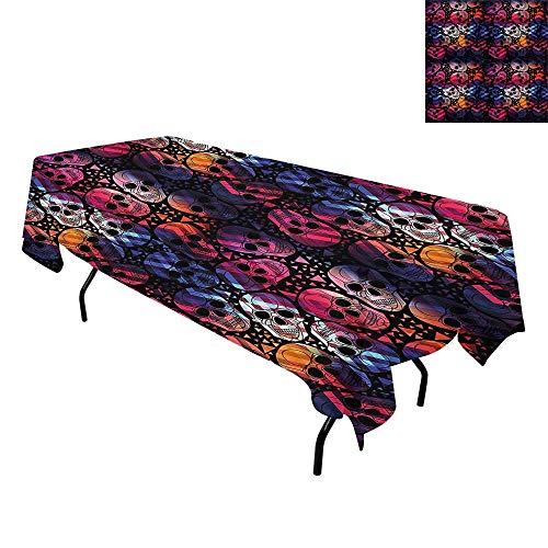 Colorful skull-patterned tablecloth draped over a table with black legs.