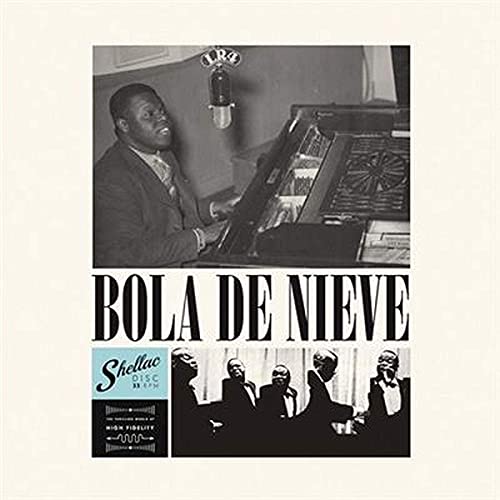 Vintage album cover featuring a pianist and band in black and white.