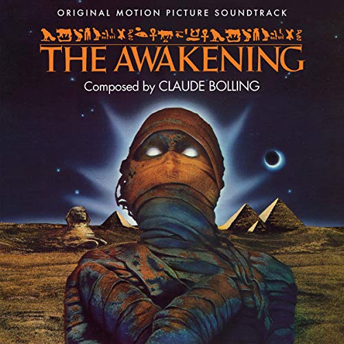 CD cover for "The Awakening" soundtrack, featuring a masked figure and pyramids.