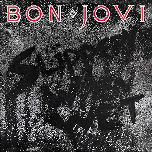 Bon Jovi’s “Slippery When Wet” album cover, black and white textured background.