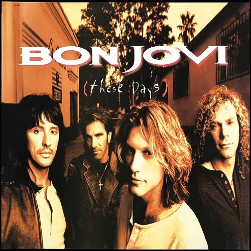 The four members of Bon Jovi posing on a street in a sepia-toned photograph.