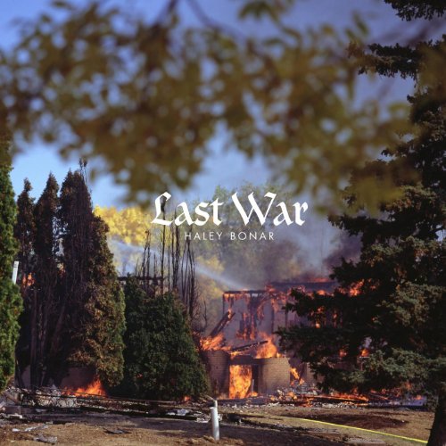 Album cover: burning building framed by trees, text “Last War” visible.