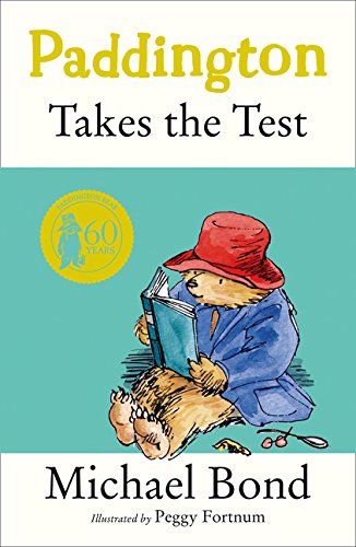 Paddington Bear reading a book, cover of "Paddington Takes the Test.