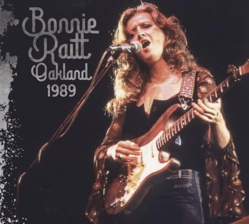 Bonnie Raitt performing with a guitar, album cover for Oakland 1989.