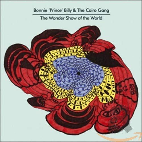 CD cover for “The Wonder Show Of The World” with swirling red and blue design.