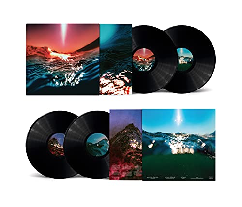 Bonobo "Fragments" vinyl records and album artwork with abstract landscapes.