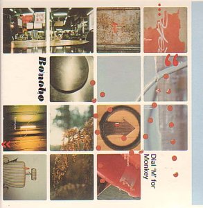 Album cover with a grid of abstract photos and red dot accents.