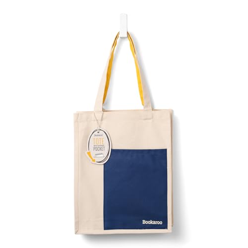 Cream and navy blue tote bag with yellow handles hanging on a hook.